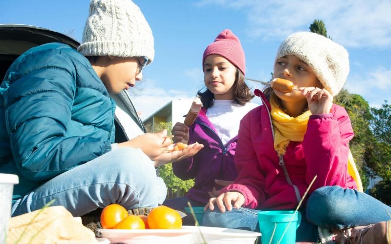 a group of people eating outside