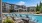 a pool with chairs around it