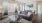 a spacious room with a couch and coffee table