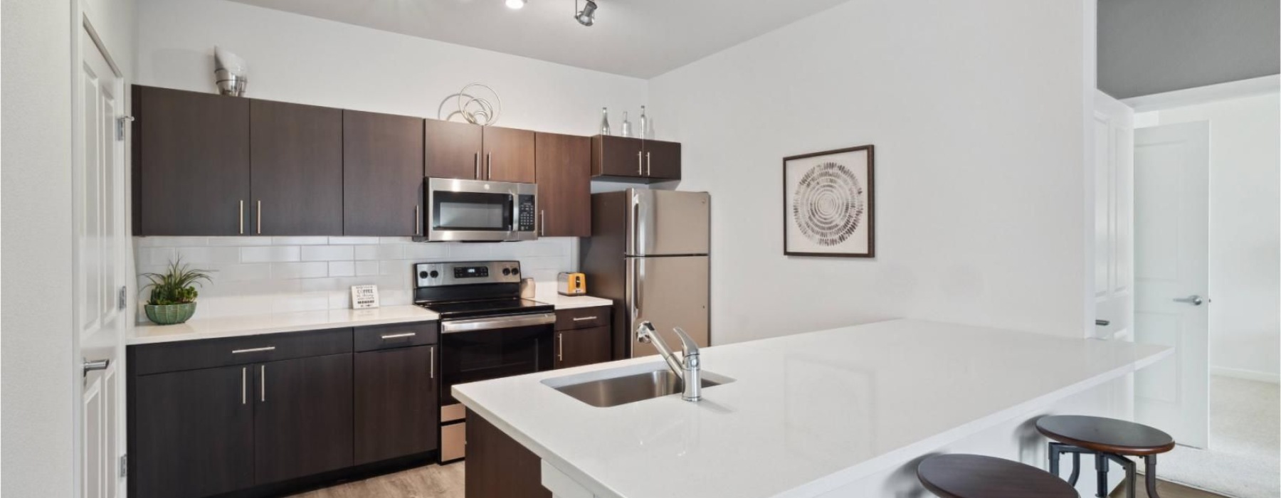 a kitchen with black cabinets